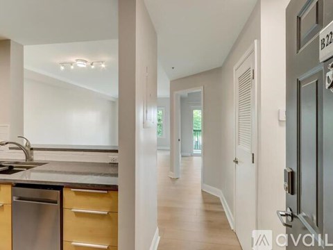 A kitchen with a sink, stove, and refrigerator is available for rent.