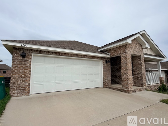 A house with a garage and a driveway.