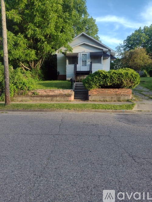 A house with a white door and a porch.