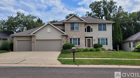 A house with a garage is for sale.