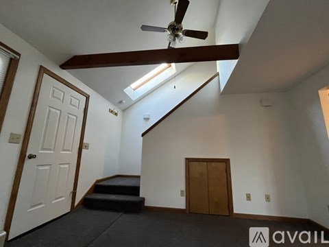 A room with a staircase leading to the second floor.