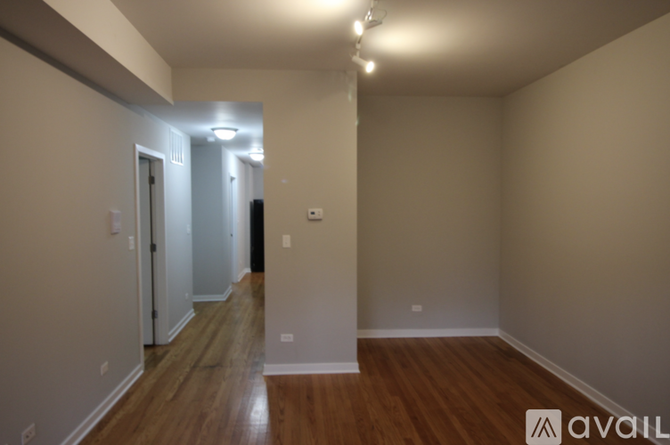 A room with wooden floors and white walls.