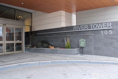 The entrance to the River Tower building with a sign that says "Available".