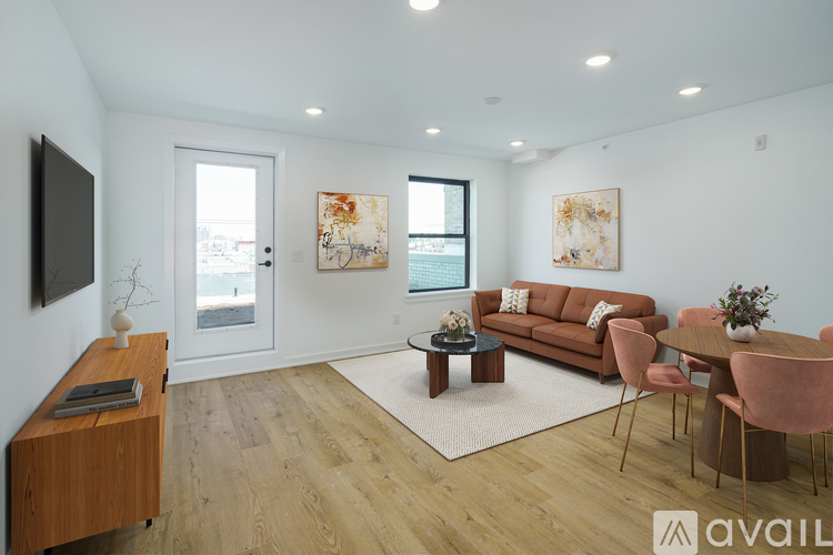 A living room with a brown sofa, a wooden cabinet, and a coffee table.
