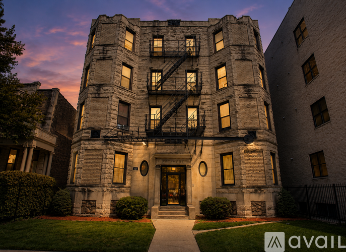 A large, old building with a dark front door and windows.