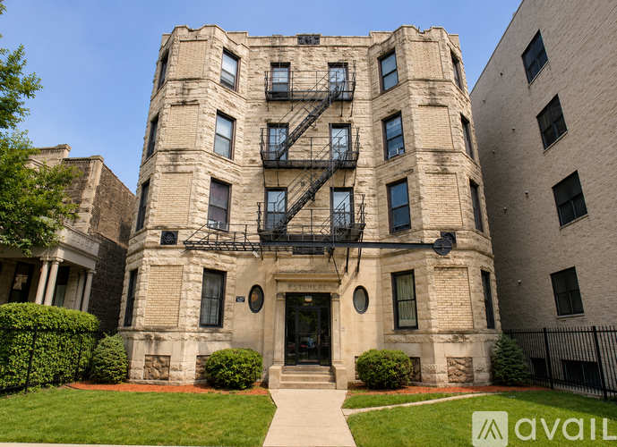 A large, old building with a fire escape on the side.