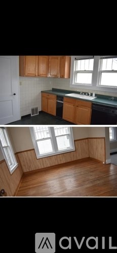 A kitchen with wooden cabinets and a window.