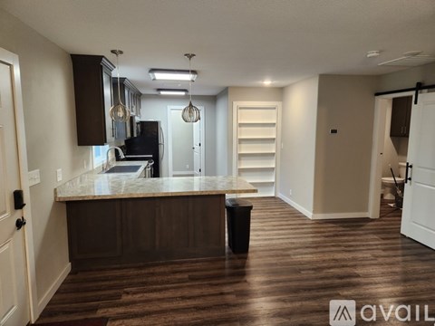 A kitchen with brown cabinets and a white countertop.