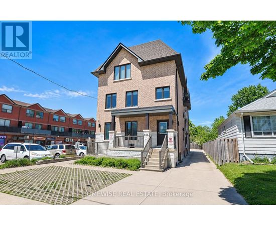 A house with a brick facade is for sale.