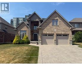 A large house with a brick facade and a stone entrance.