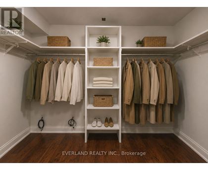 A closet with clothes and shoes.
