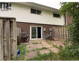A house with a backyard and a fence.