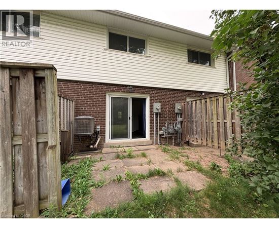 A house with a backyard and a fence.