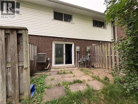A house with a backyard and a fence.