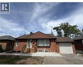 A house with a brown roof and a white garage door.