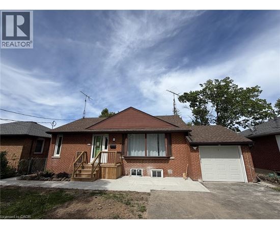 A house with a brown roof and a white garage door.