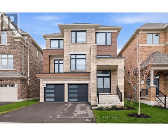 A modern two-story house with a garage is for sale by RE/MAX Rouge River Realty.