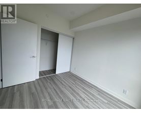 A room with a white door and a white wall.