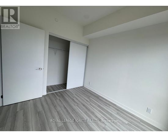 A room with a white door and a white wall.