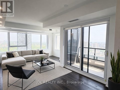 A modern living room with a view of the city.