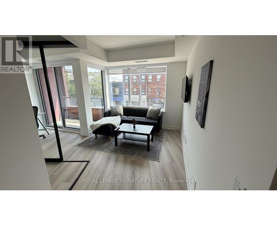 A living room with a couch and a chair.