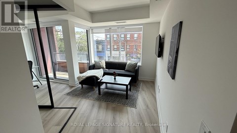 A living room with a couch and a chair.