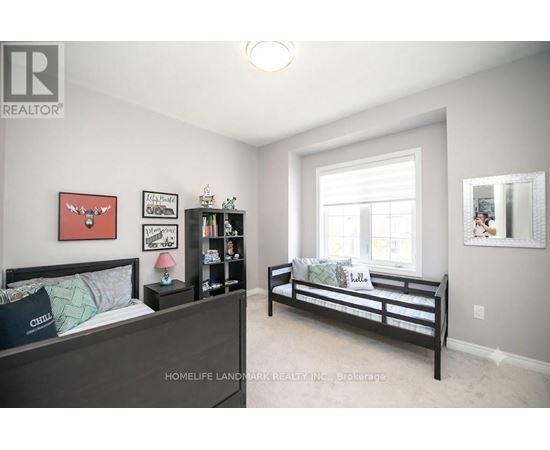 A bedroom with a bed and a bench in it.
