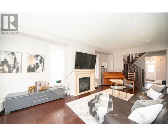A living room with a fireplace and a couch.