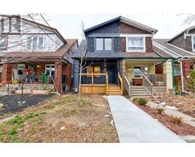 A house with a front yard and a walkway leading to the front door.