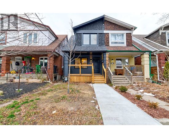 A house with a front yard and a walkway leading to the front door.