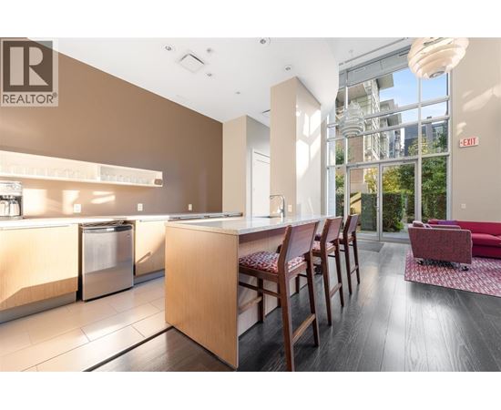 A modern office space with a reception desk and chairs.