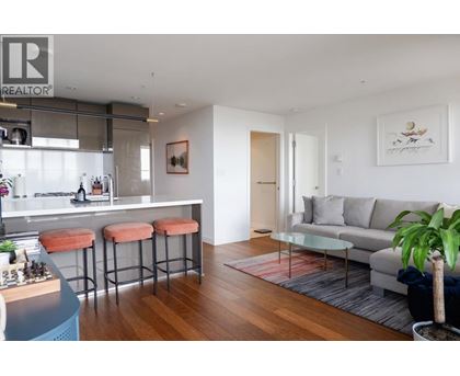 A modern living room with a bar area and a couch.