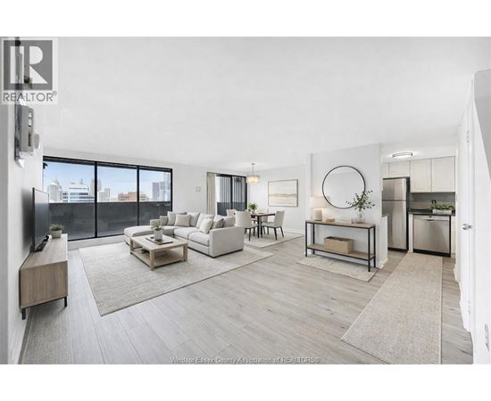 A modern living room with a large window overlooking the city.