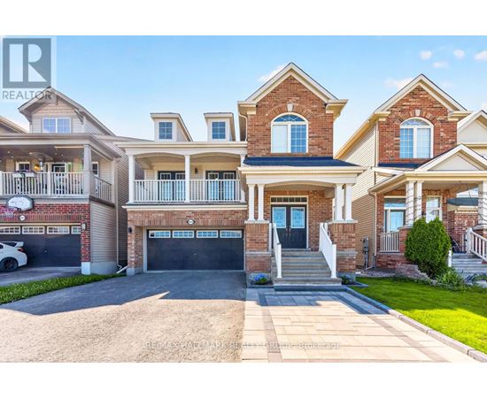 A large, multi-story house with a garage is for sale.