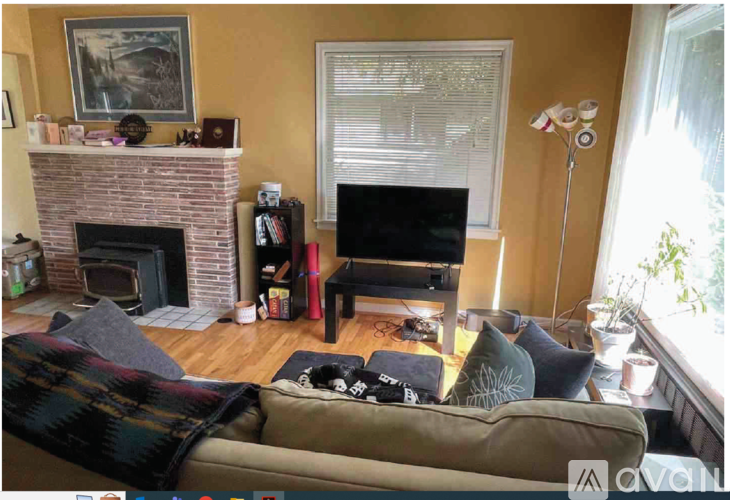 A living room with a fireplace and a couch.