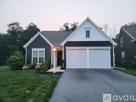 A house with a garage is available for sale.