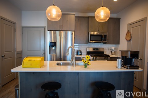 A kitchen with a white counter top and a yellow box on it.