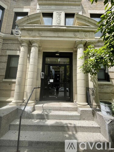 A building with a stone facade and a large entrance.