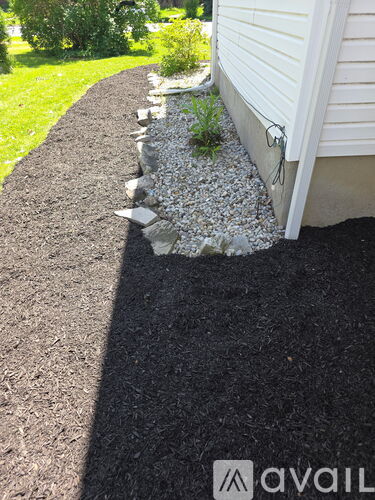 A gravel path leads to a house.