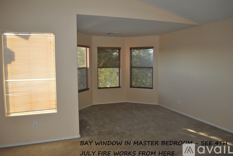 A room with a bay window in the master bedroom.