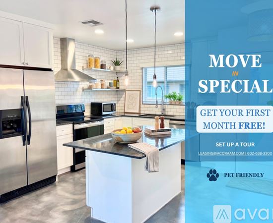 A modern kitchen with a refrigerator, microwave, and stove top oven.