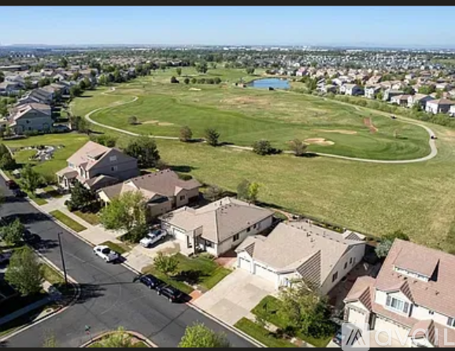 A suburban neighborhood with houses and a park.