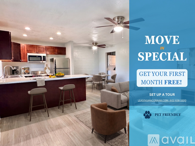 A modern kitchen with a bar area and a living room with a sofa and chairs.