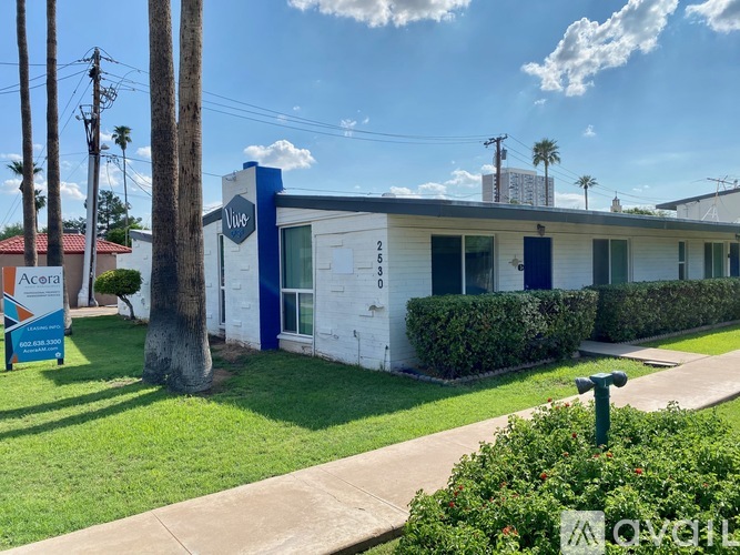 A blue and white building with a sign that says "Avelia" in front of it.