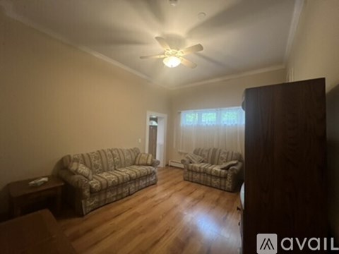 A living room with a couch and a chair.