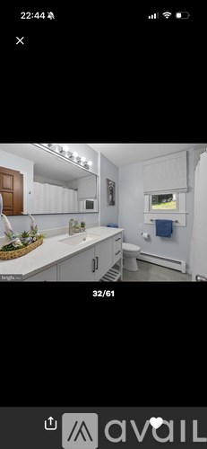 A kitchen with white cabinets and a countertop.