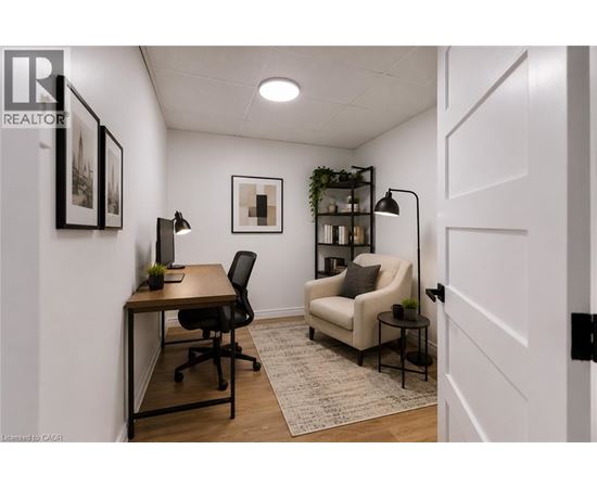 A room with a desk, chair, and couch.