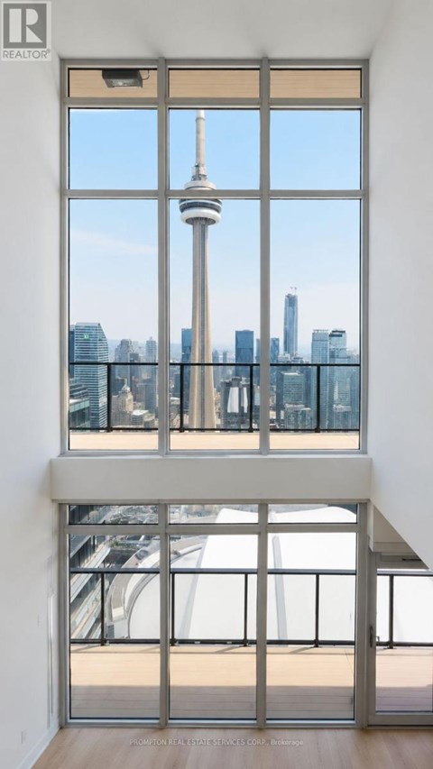 A large window with a view of the city skyline.