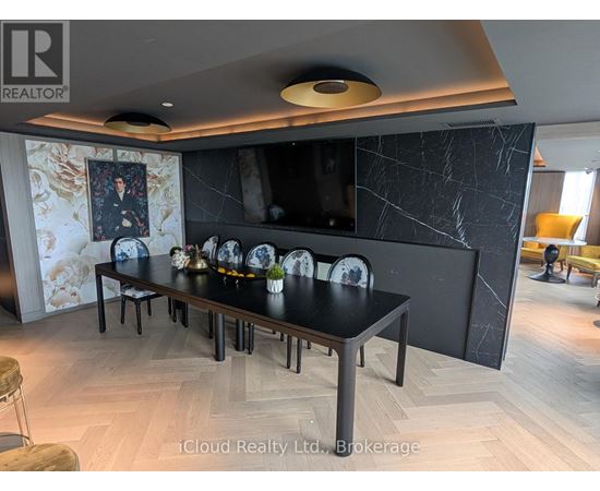 A modern dining room with a long table set for six.