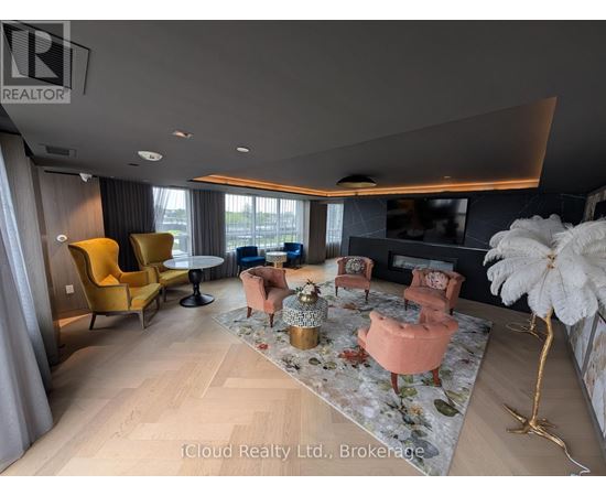 A living room with a yellow chair and a fluffy white decoration.